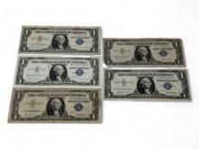 Lot of (5) 1957 $1 Blue seal silver certificate bank notes. Includes: (3) 1957, (1) 1957A Star, and