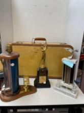 Vintage suitcase, and three trophies
