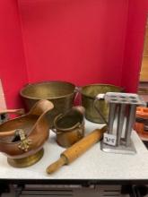Copper and brass pots, candle mold, and a rolling pin