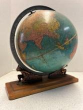 replogle globe w/ atlas holding the globe