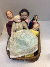 basket of vintage dolls