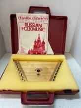 Russian auto harp in case with music book