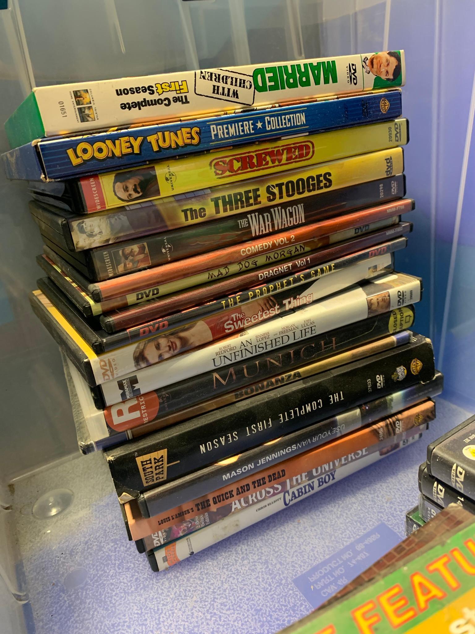 Large Group of DVDs and VHS Tapes