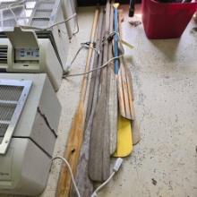 assorted lot of oars and paddles