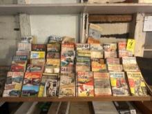 display full of 50's and 60's car magazines