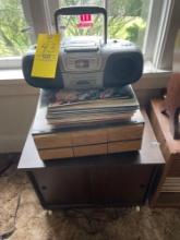 Rolling cabinet, cd organizer, records, radio