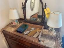 contents on top of dresser, 2 lamps, brush, glass figurings, jewelry box