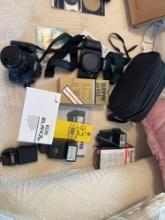 2 Canon EOS cameras with accessories and light packs