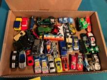 Box of Hot-Wheel cars and Lego like toys